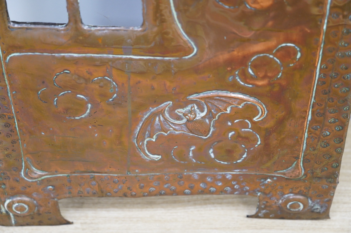 An Arts and Crafts hammered copper and wrought iron fire screen, 73cm. Condition - fair to good, lacking glass panel